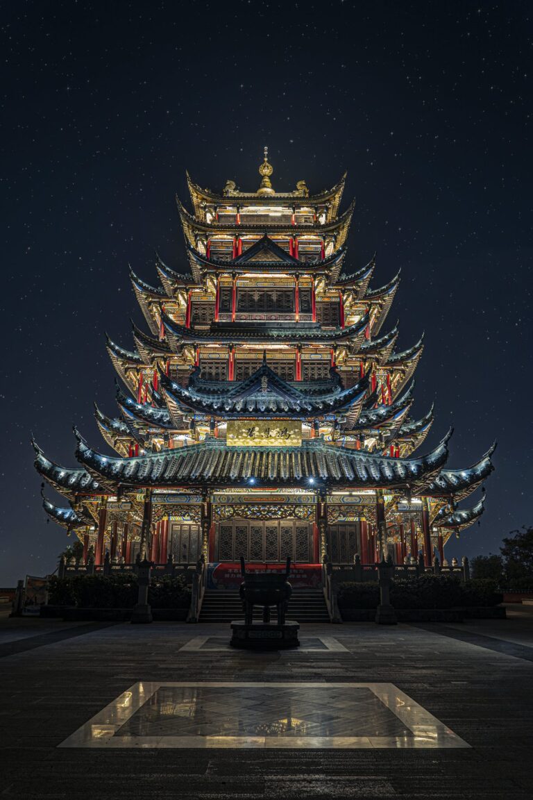 Blue, Yellow, and Green Lighted Pagoda Tower